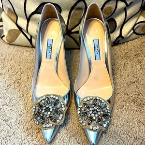 Prada mirrored patent leather, embellished toes, high heels.